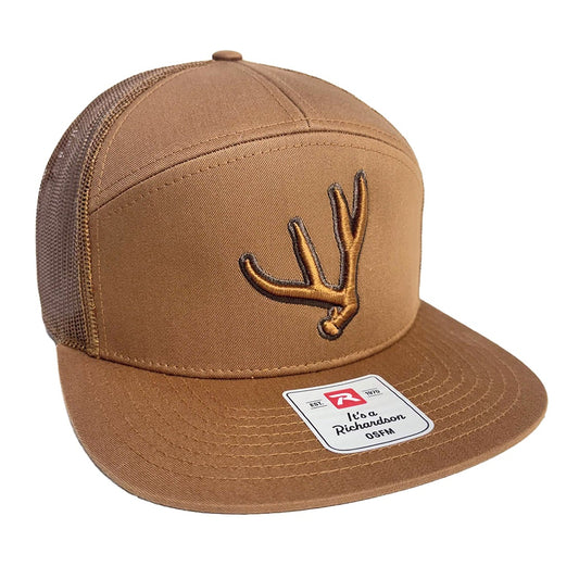 Carmel colored 7 panel trucker hat with matching puff embroidered mule deer antler