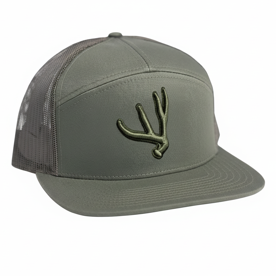 Olive colored 7 panel trucker hat with matching puff embroidered mule deer antler